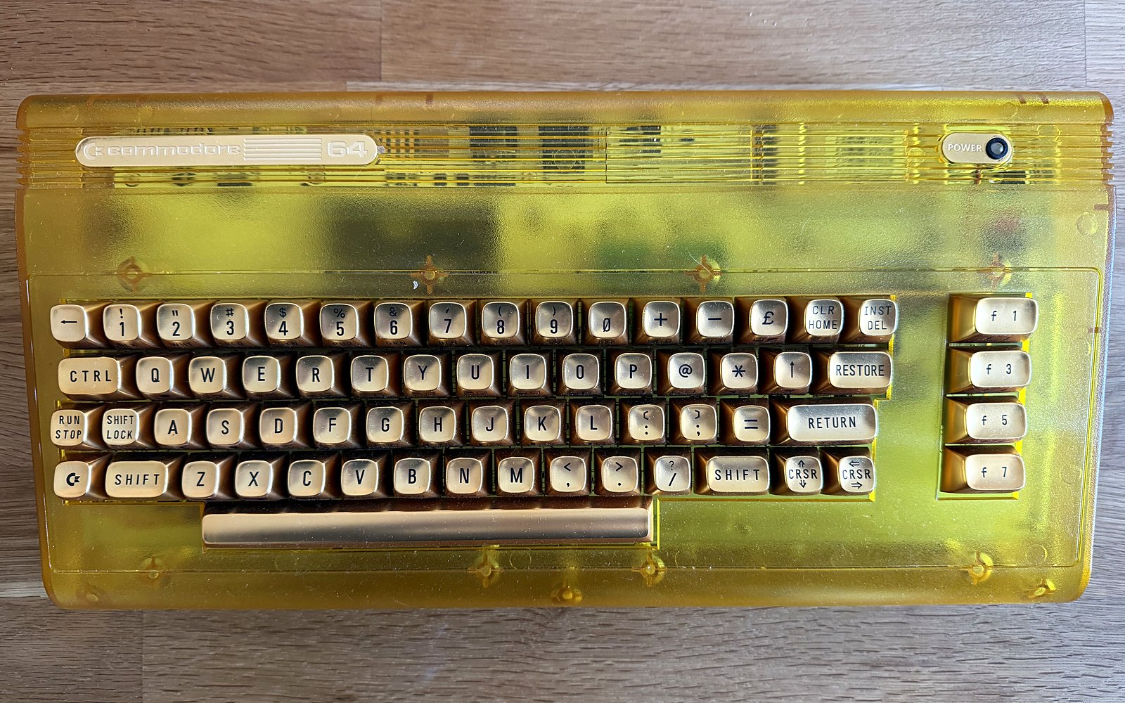 The C64 Ultimate Founder's Edition, translucent yellow case with gold keycaps